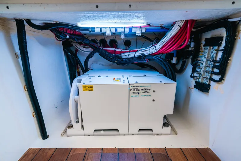 Slide: The Image of 2021 Contender 44 ST engine compartment with wiring and electrical components. - 21