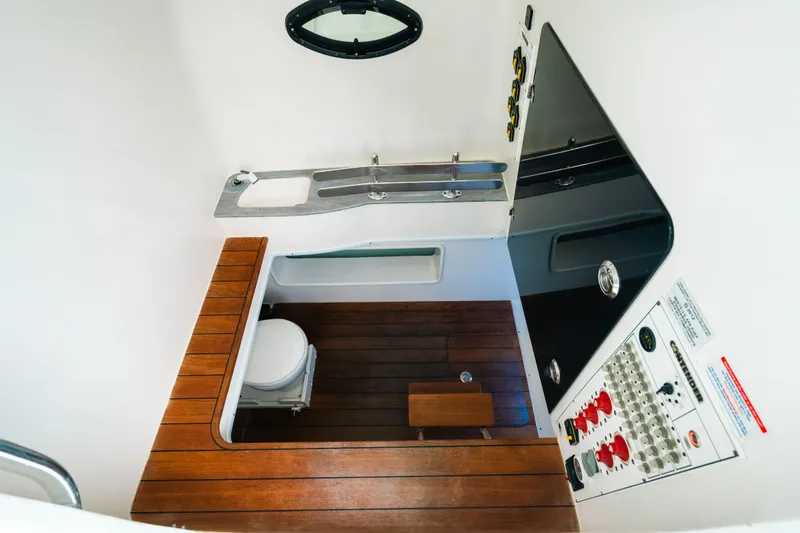 Slide: The Image of 2021 Contender 44 ST boat interior with wooden flooring and control panel. - 22