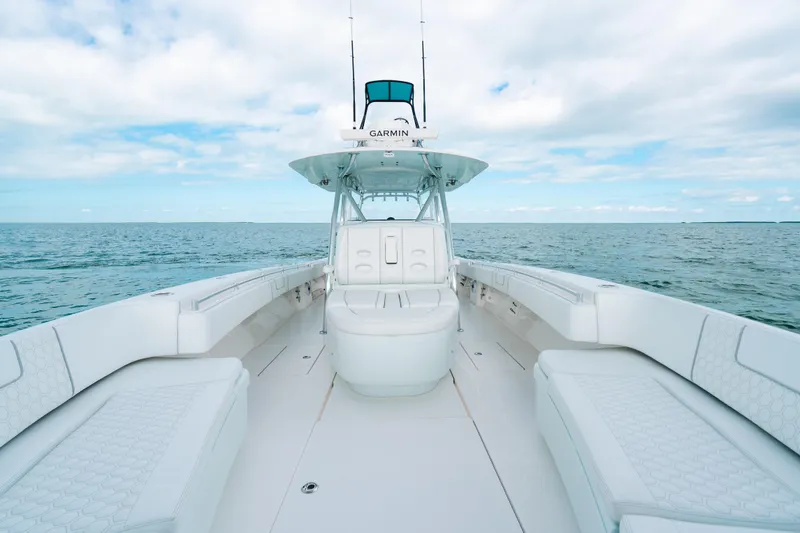 Slide: The Image of 2021 Contender 44 ST boat interior with ocean view, featuring spacious seating and modern design. - 23