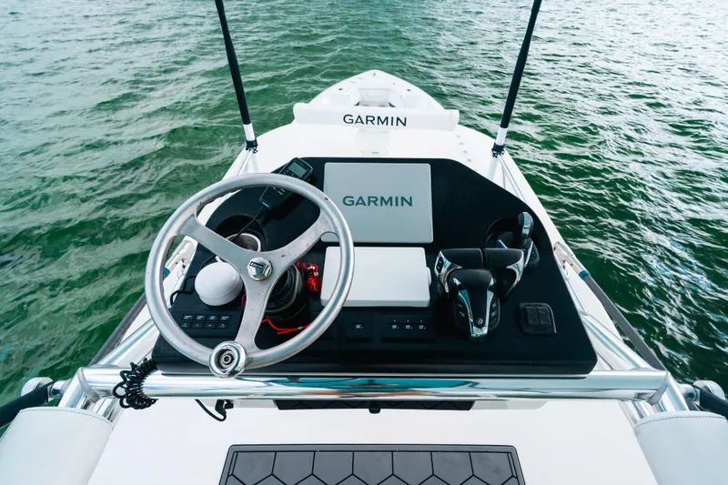 Slide: The Image of 2021 Contender 44 ST boat helm with Garmin navigation on open water. - 25