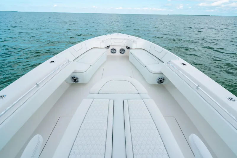 Slide: The Image of 2021 Contender 44 ST boat interior with white seating, on open water. - 32