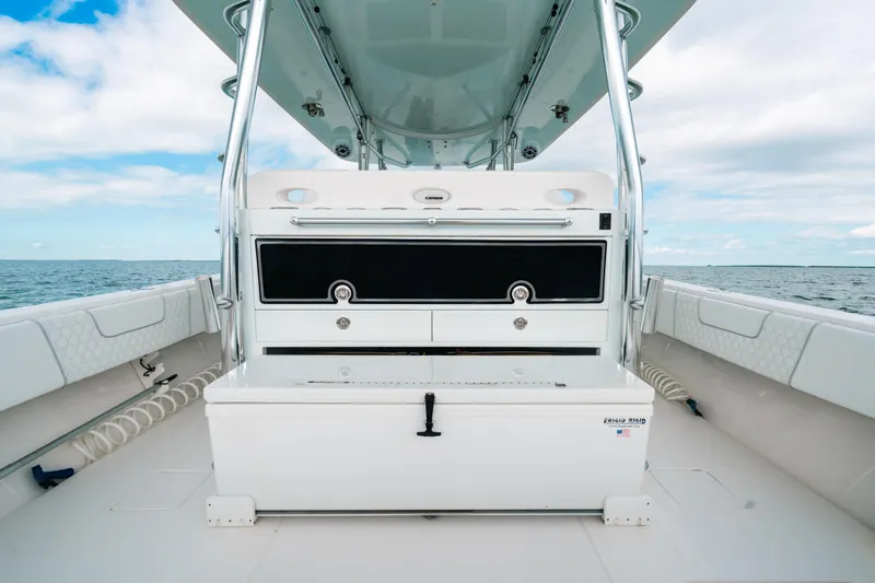 Slide: The Image of 2021 Contender 44 ST boat interior with storage and seating, ocean view. - 34