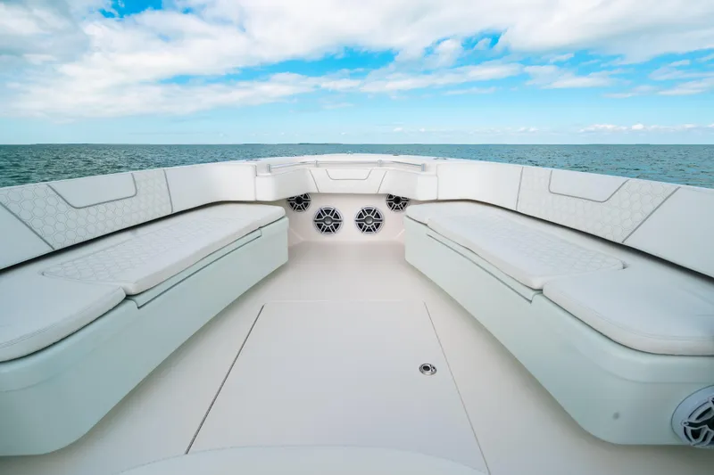 Slide: The Image of 2021 Contender 44 ST boat interior with white seating, ocean view, and blue sky. - 38