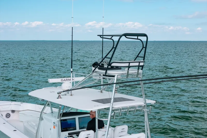 Slide: The Image of 2021 Contender 44 ST boat on open water with advanced navigation equipment. - 5