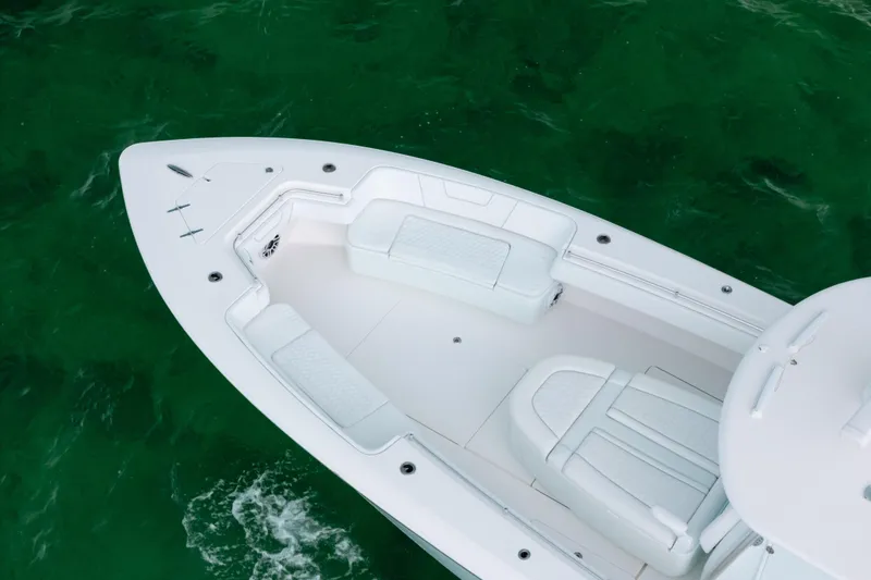 Slide: The Image of 2021 Contender 44 ST boat with white seating on clear green water. - 6