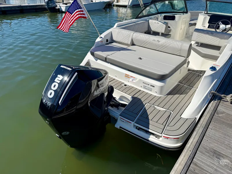 Slide: The Image of The image shows a 2026 Sea Ray SDX 230 Outboard boat with a Mercury 200 HP engine. - 6