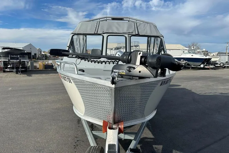 Slide: The Image of 2021 Hewescraft 240 Ocean Pro ET boat with Minn Kota motor on trailer. - 2