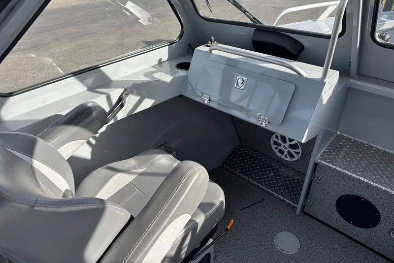 Slide: The Image of Interior of 2021 Hewescraft 240 Ocean Pro ET boat with seating and storage. - 5