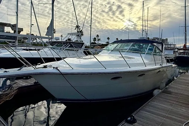 The Image of 1990 Tiara Yachts 3600 Open docked at marina during sunset. - 0