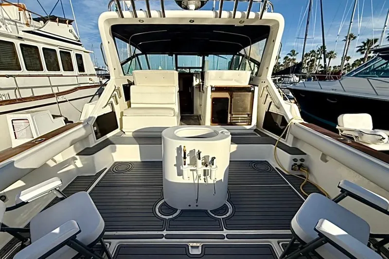 Slide: The Image of 1990 Tiara Yachts 3600 Open boat interior with seating and fishing equipment. - 13