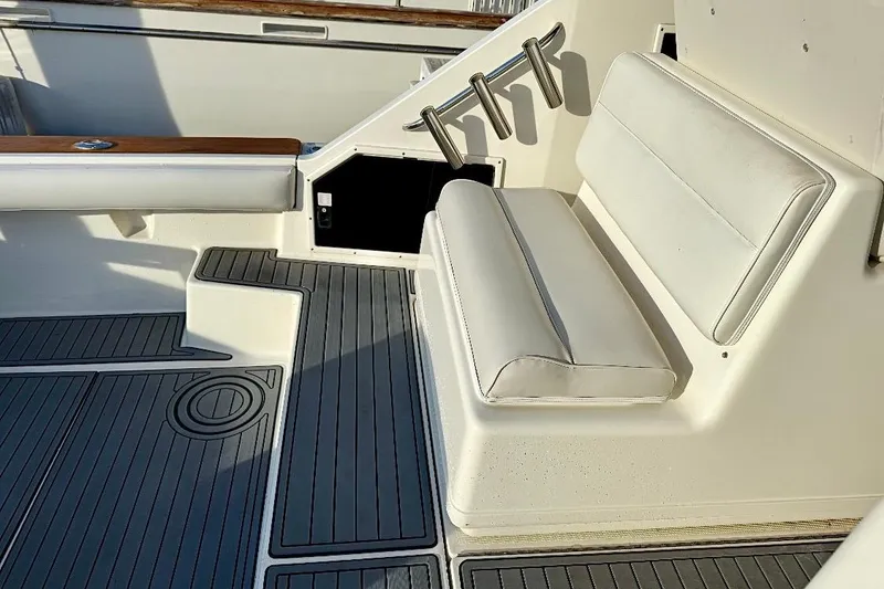 Slide: The Image of Tiara Yachts 3600 Open 1990 model with cushioned seating and teak accents. - 18