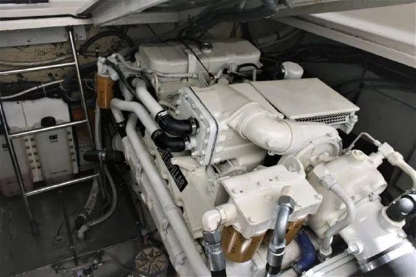 Slide: The Image of Engine room of a 1990 Tiara Yachts 3600 Open, showcasing mechanical components. - 23