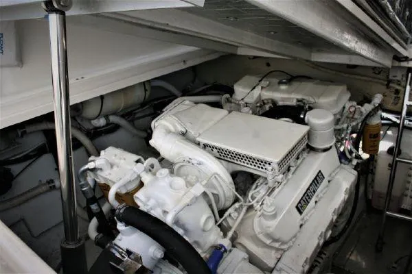 Slide: The Image of Engine room of 1990 Tiara Yachts 3600 Open, showcasing powerful marine engines. - 24