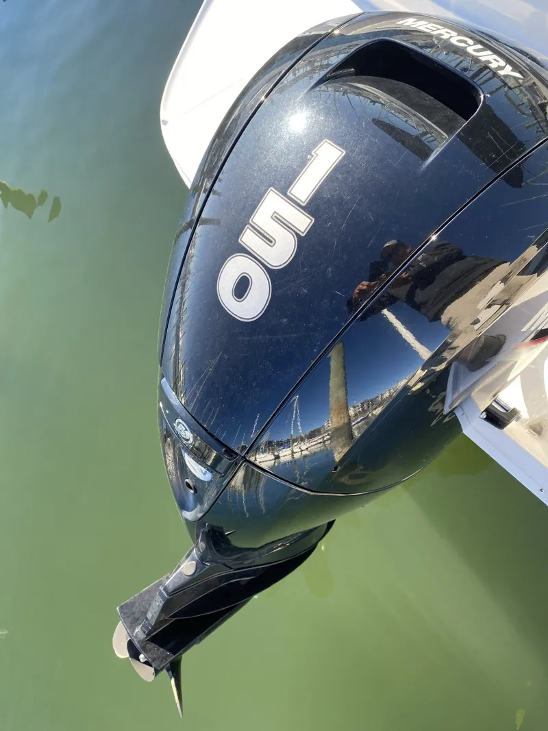 Slide: The Image of 2024 Bayliner VR6 with Mercury 150 outboard engine on calm water. - 6