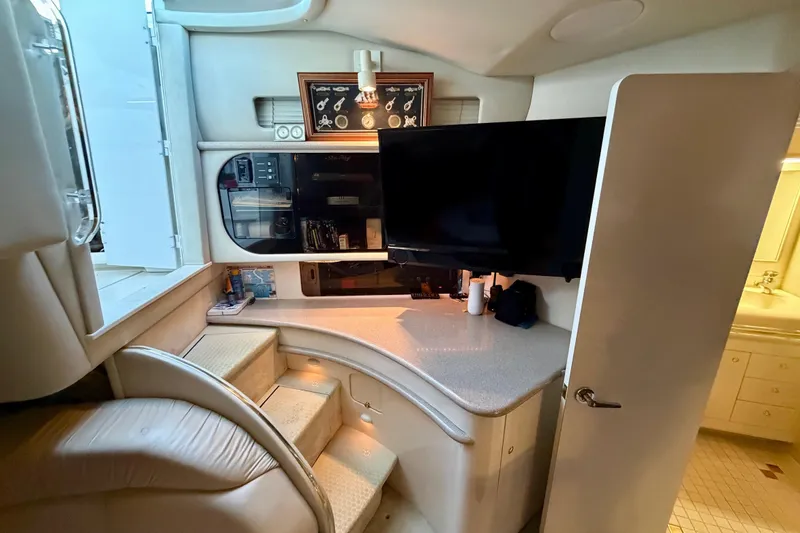 Slide: The Image of Interior of 1997 Sea Ray 500 Sundancer yacht with modern amenities and elegant design. - 13
