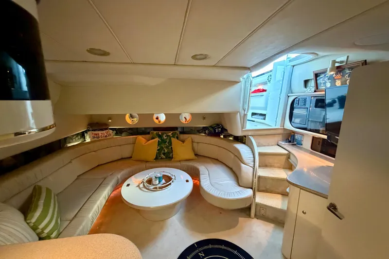 Slide: The Image of Luxurious interior of a 1997 Sea Ray 500 Sundancer yacht with plush seating and modern amenities. - 14