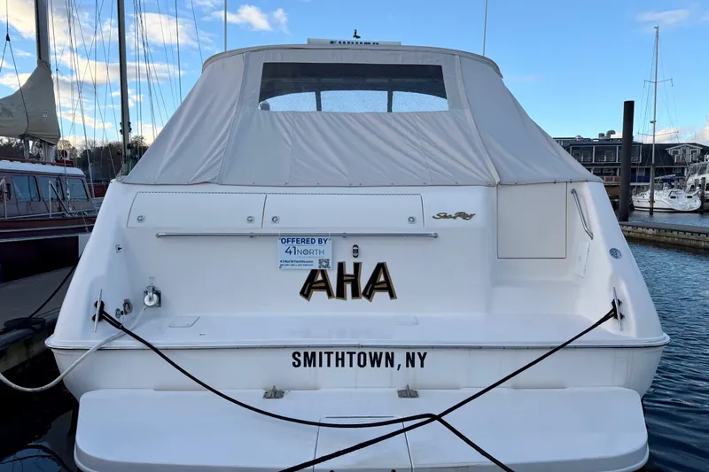 Slide: The Image of 1997 Sea Ray 500 Sundancer docked, rear view with cover, Smithtown, NY. - 2