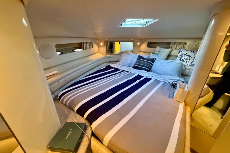 Slide: The Image of Luxurious cabin interior of 1997 Sea Ray 500 Sundancer yacht with cozy bedding. - 24