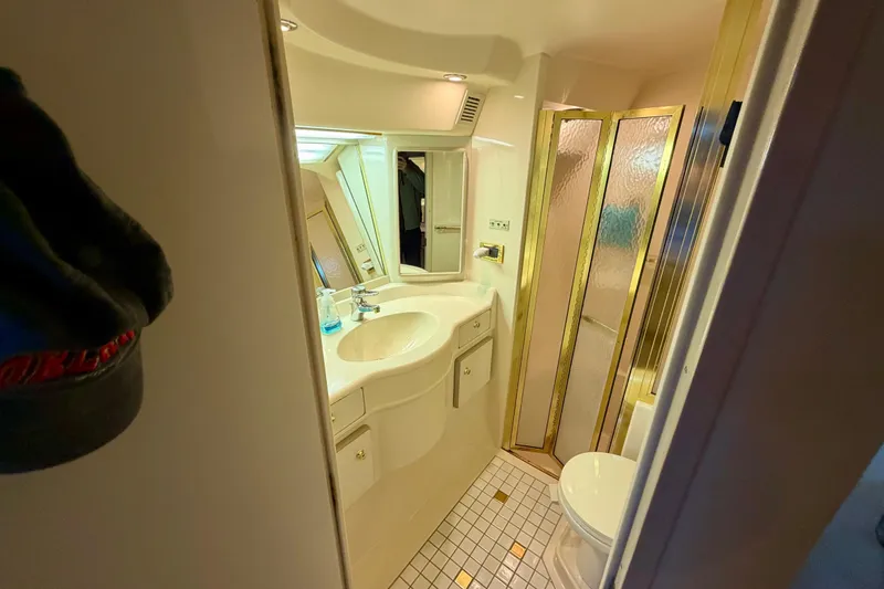 Slide: The Image of Luxurious bathroom in 1997 Sea Ray 500 Sundancer yacht with shower and vanity. - 25