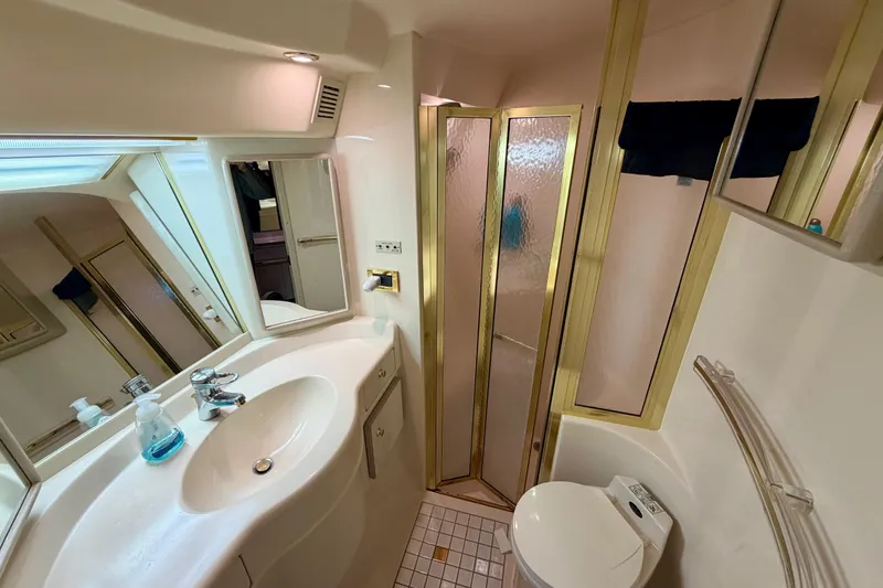 Slide: The Image of Bathroom interior of 1997 Sea Ray 500 Sundancer yacht with shower and sink. - 26