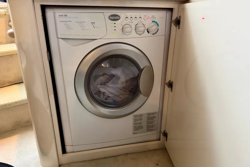 Slide: The Image of Compact washing machine inside a 1997 Sea Ray 500 Sundancer yacht cabinet. - 29