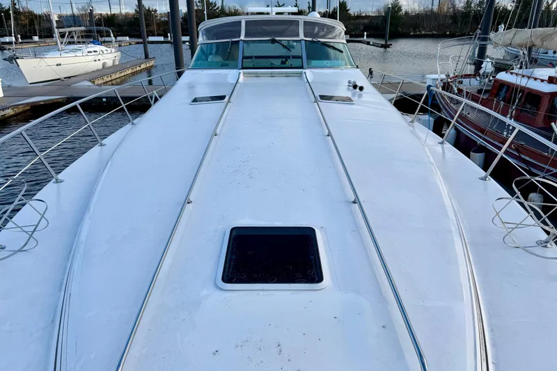 Slide: The Image of 1997 Sea Ray 500 Sundancer yacht docked at marina, top deck view. - 3