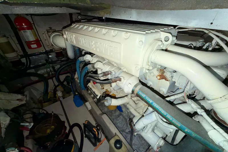 Slide: The Image of Engine room of 1997 Sea Ray 500 Sundancer with marine power components. - 34