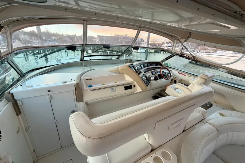 Slide: The Image of 1997 Sea Ray 500 Sundancer yacht cockpit with luxurious seating and modern controls. - 40