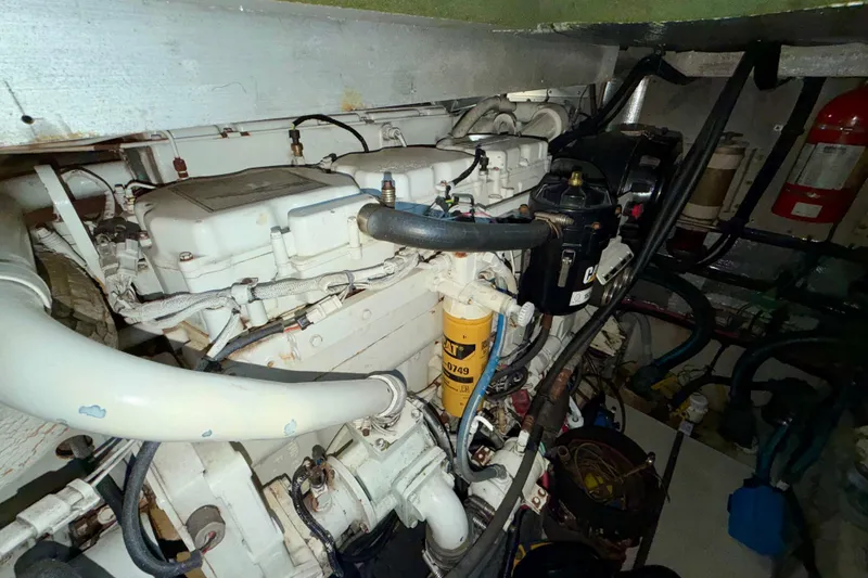 Slide: The Image of Engine room of 1997 Sea Ray 500 Sundancer with visible components and wiring. - 41