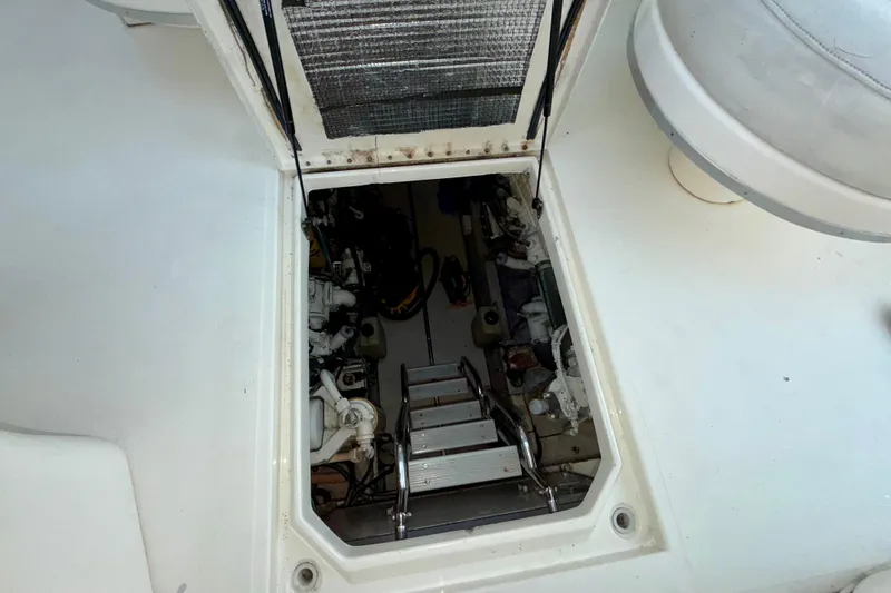 Slide: The Image of Engine compartment of 1997 Sea Ray 500 Sundancer with visible ladder and machinery. - 43