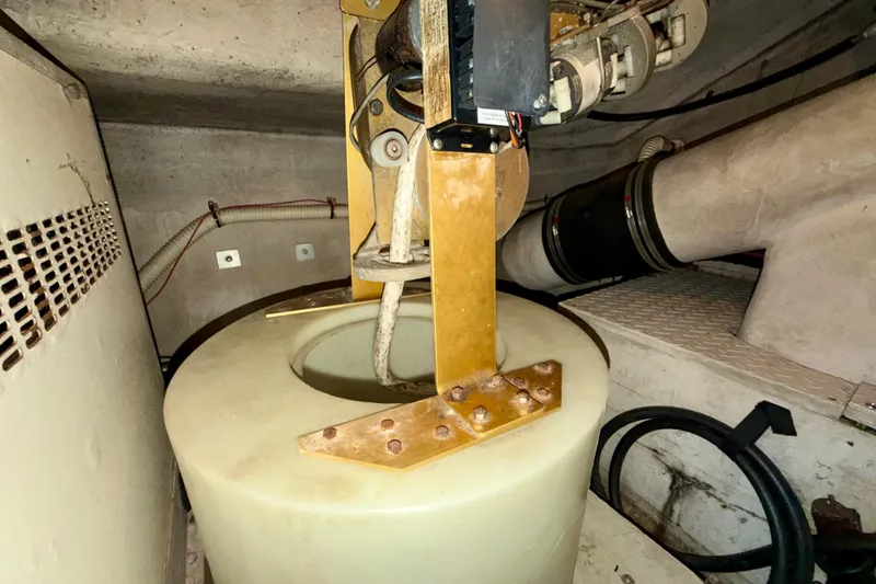 Slide: The Image of Engine room of 1997 Sea Ray 500 Sundancer with mechanical components and wiring. - 44