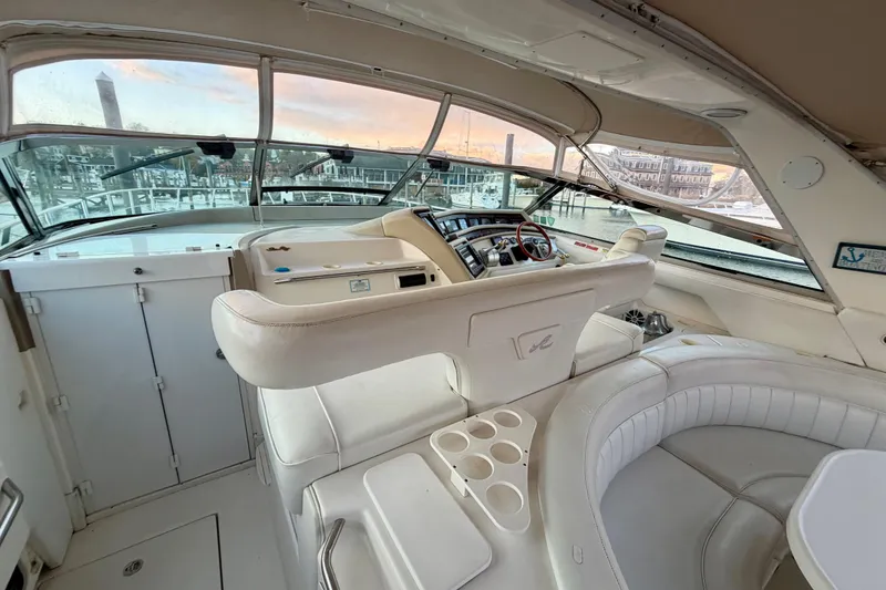 Slide: The Image of 1997 Sea Ray 500 Sundancer yacht interior with helm and seating area. - 9