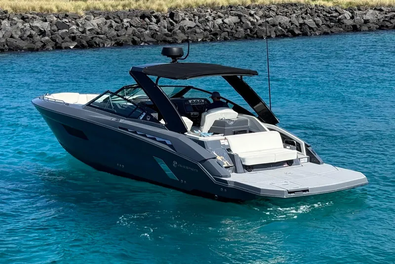 Slide: The Image of 2022 Cruisers Yachts 338 South Beach Edition Bow Rider on clear blue water. - 2