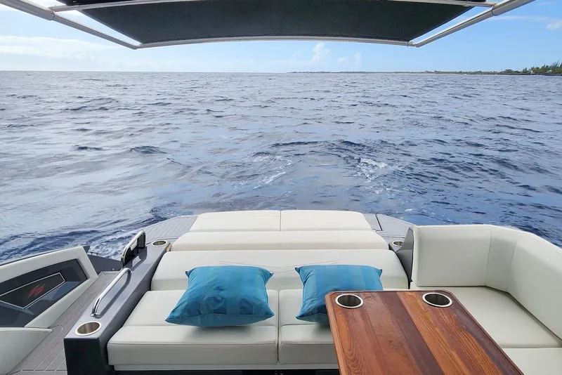 Slide: The Image of 2022 Cruisers Yachts 338 South Beach Edition Bow Rider, luxurious seating with ocean view. - 27
