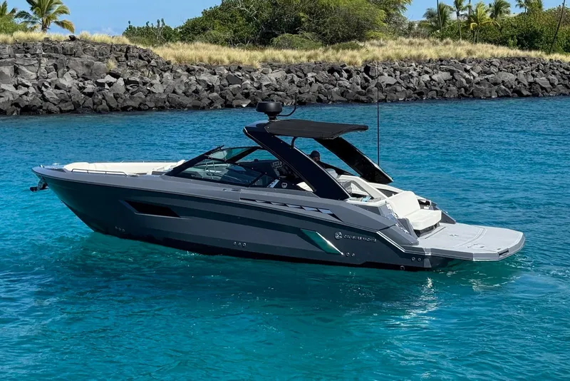 Slide: The Image of 2022 Cruisers Yachts 338 South Beach Edition Bow Rider on clear blue water. - 3