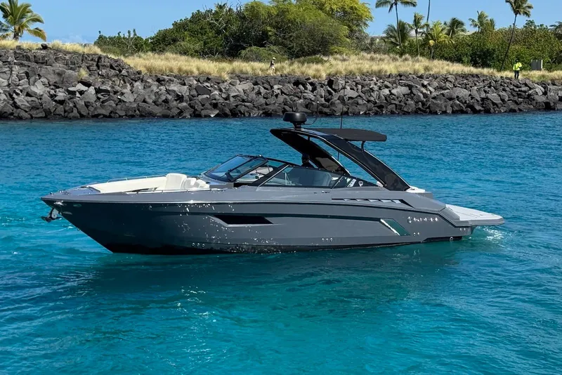 Slide: The Image of 2022 Cruisers Yachts 338 South Beach Edition Bow Rider on clear blue water. - 4
