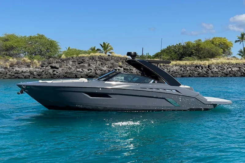 Slide: The Image of 2022 Cruisers Yachts 338 South Beach Edition Bow Rider on clear blue water. - 5
