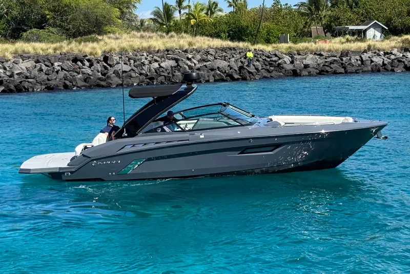 Slide: The Image of 2022 Cruisers Yachts 338 South Beach Edition Bow Rider on clear blue water. - 6
