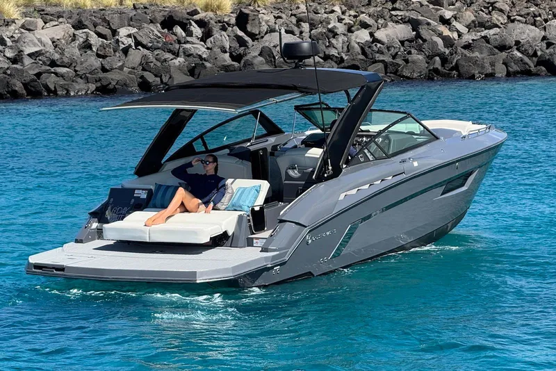 Slide: The Image of 2022 Cruisers Yachts 338 South Beach Edition Bow Rider on clear blue water. - 7