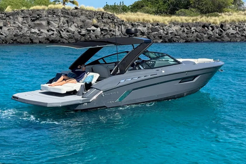 Slide: The Image of 2022 Cruisers Yachts 338 South Beach Edition Bow Rider on clear blue water. - 8