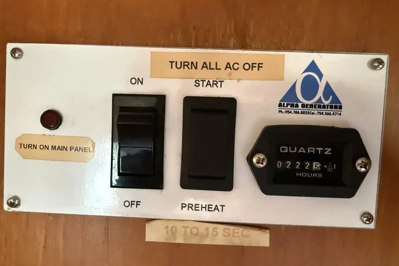 Slide: The Image of Control panel on a 1985 Grand Banks 36 Classic boat with generator switches. - 20