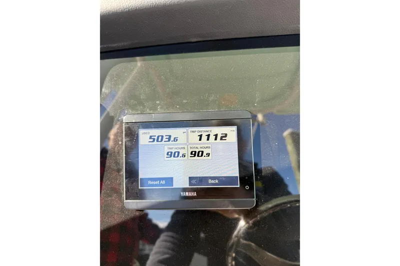 Slide: The Image of Yamaha display on 2022 Robalo R242 Explorer showing trip data and fuel usage. - 15