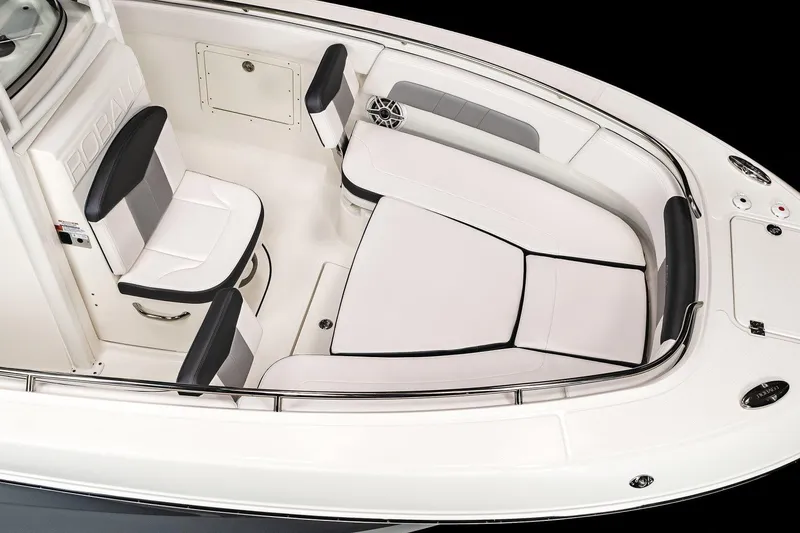 Slide: The Image of Manufacturer Provided Image: 2022 Robalo R242 Explorer boat interior with cushioned seating and storage compartments. - 25