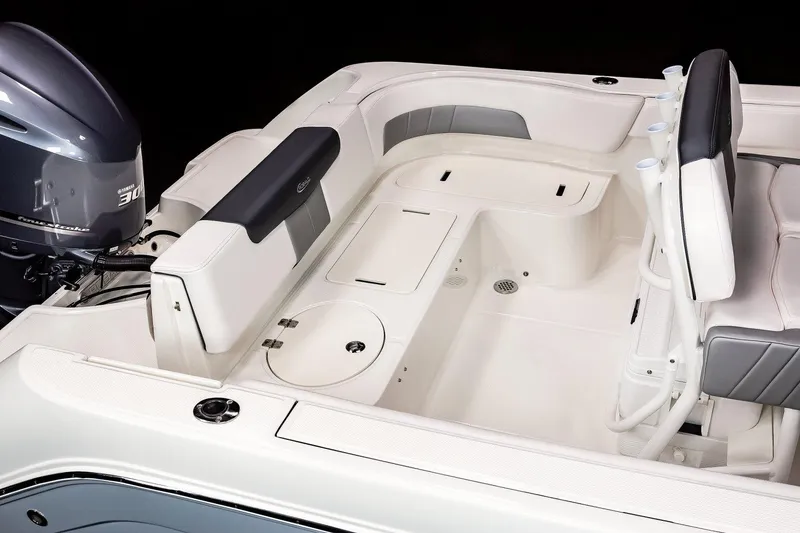 Slide: The Image of Manufacturer Provided Image: 2022 Robalo R242 Explorer boat interior with seating and storage compartments. - 26
