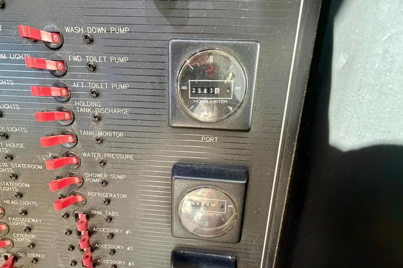 Slide: The Image of Control panel of 1995 Bayliner 4788 Pilot House Motoryacht with switches and hour meter. - 27