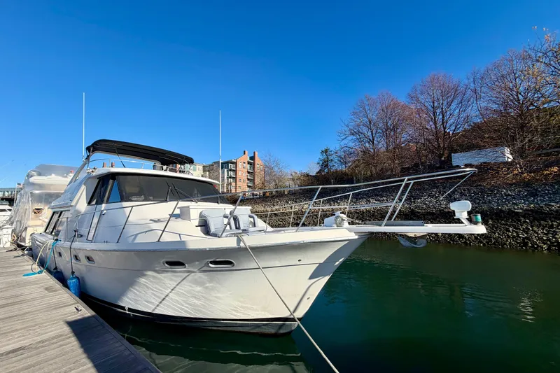 Slide: The Image of 1995 Bayliner 4788 Pilot House Motoryacht docked on a sunny day. - 3