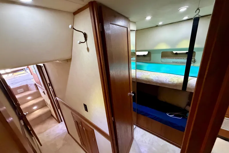 Slide: The Image of Interior of 1995 Bayliner 4788 Pilot House Motoryacht with cozy cabin and bunk beds. - 34