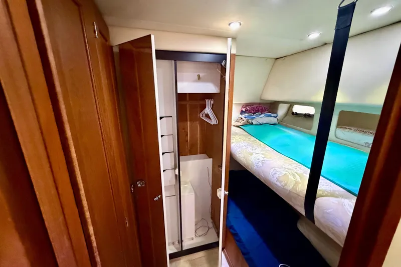 Slide: The Image of Interior cabin of 1995 Bayliner 4788 Pilot House Motoryacht with bunk beds and closet. - 35