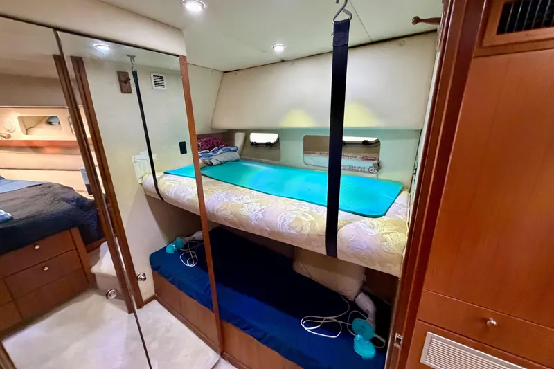 Slide: The Image of Interior of 1995 Bayliner 4788 Pilot House Motoryacht with cozy bunk beds. - 36