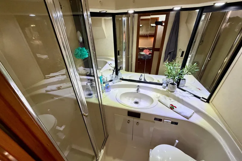 Slide: The Image of Luxurious bathroom in 1995 Bayliner 4788 Pilot House Motoryacht with modern fixtures and decor. - 40
